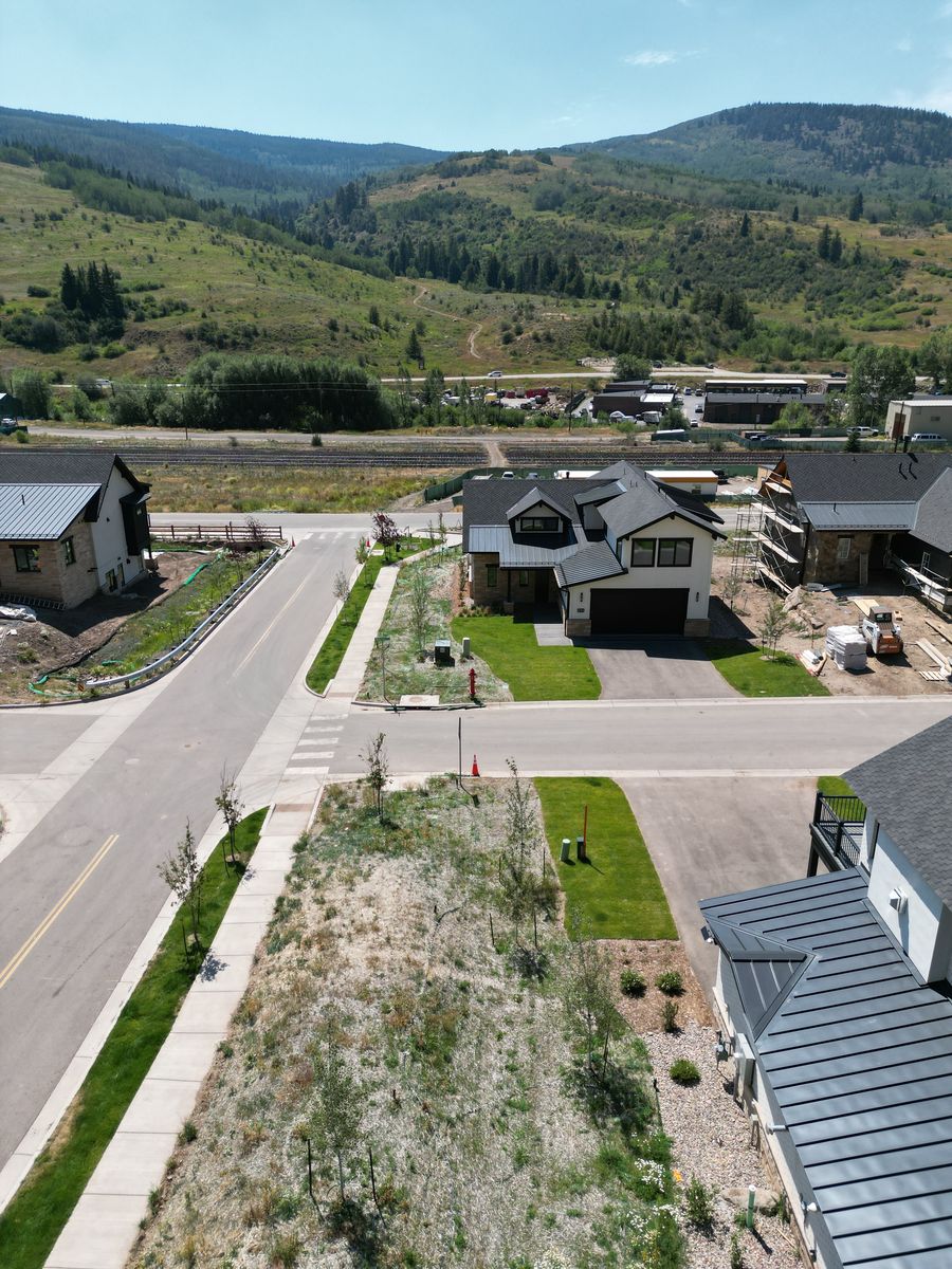Aerial view of a mountain home with newly installed lawn and landscaping in Minturn, Colorado