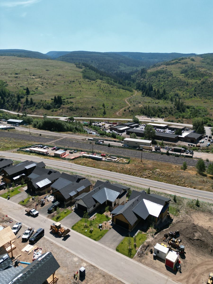 Aerial view of a residential street with landscaping underway in Minturn, Colorado